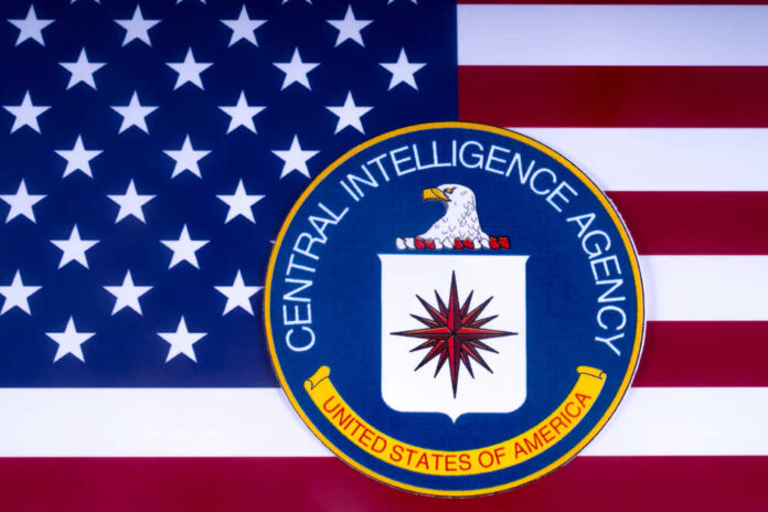 CIA emblem on American flag background.