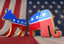 Donkey and elephant symbols with American flag background.