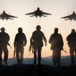 Silhouettes of soldiers and jets at sunset.