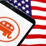 Republican elephant logo on phone, American flag background.