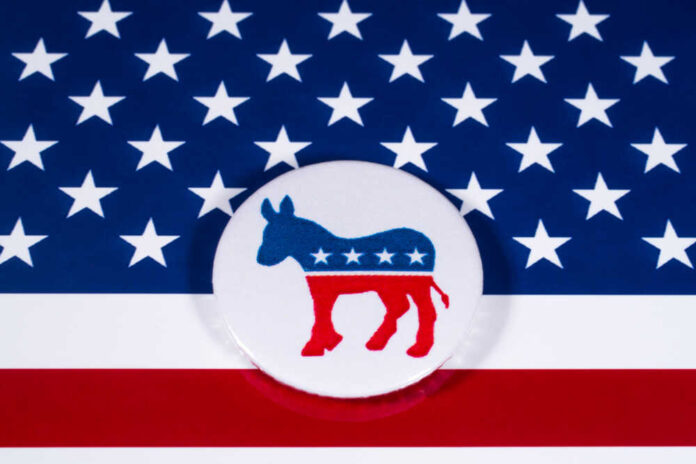 shutterstock_7864500311.jpg featured image Democratic Party donkey logo on American flag background.