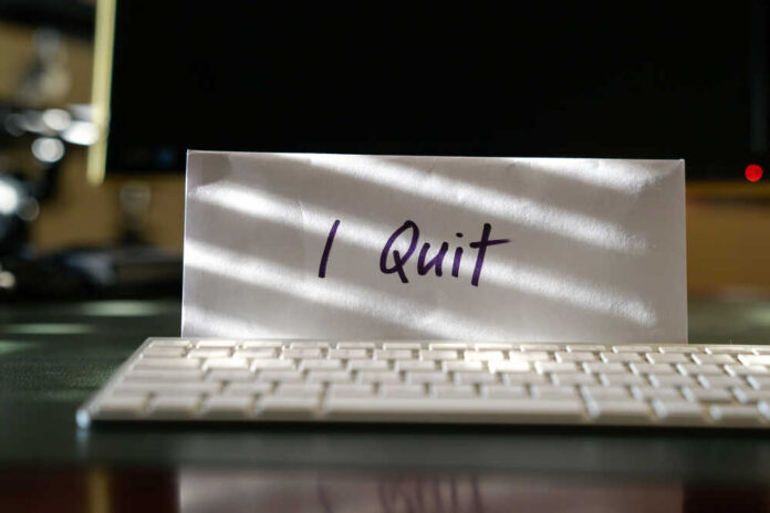 shutterstock_1438530527.jpg featured image Envelope reading I Quit behind keyboard.