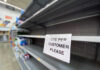Empty store shelf with one per customer sign