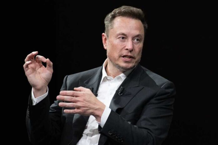 shutterstock_2318800321.jpg featured image Elon Musk in a suit talking.