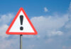 Triangular warning sign with exclamation mark
