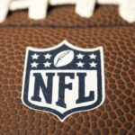 Close-up of NFL logo on American football.
