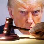 Gavel in front of Donald Trump's face on screen.