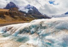 Snowy mountain landscape with glacial ice and rocks