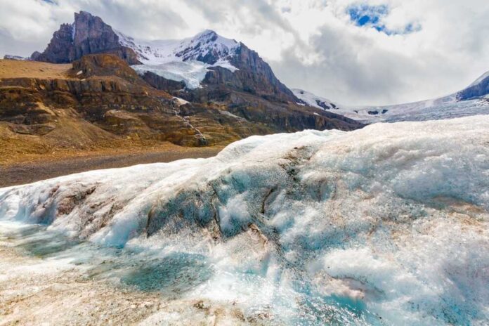 shutterstock_2481385597.jpg featured image Snowy mountain landscape with glacial ice and rocks