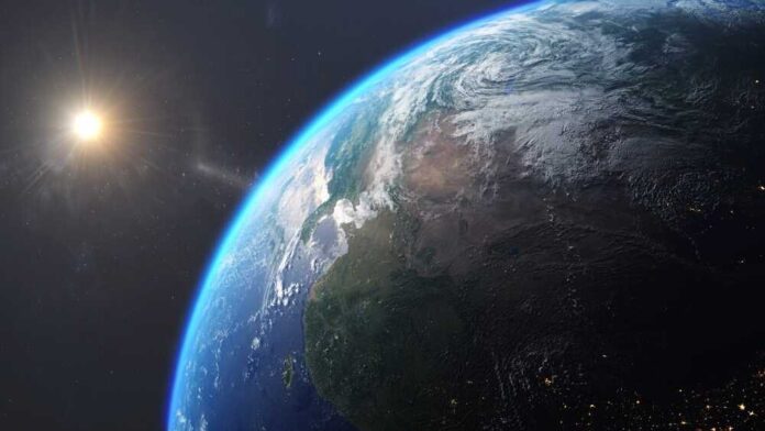 shutterstock_2506345183.jpg featured image Earth from space with sun in background.