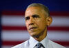 Barack Obama in front of flag.