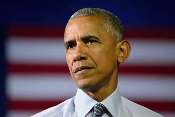 shutterstock_449433211.jpg featured image Barack Obama in front of flag.