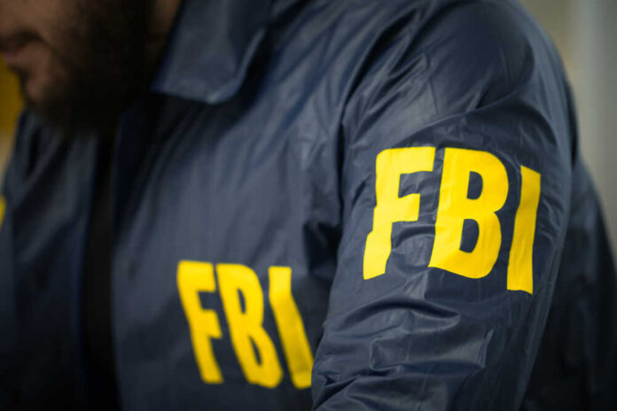 shutterstock_622639673.jpg featured image FBI agent in navy blue jacket.