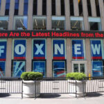 Fox News building with scrolling LED headline display.