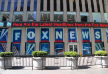 Fox News building with scrolling LED headline display.