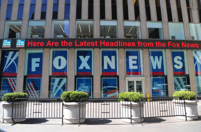 shutterstock_1078793894.jpg featured image Fox News building with scrolling LED headline display.