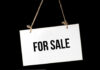 For Sale sign on a rope.