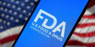 FDA logo on smartphone American flag background
