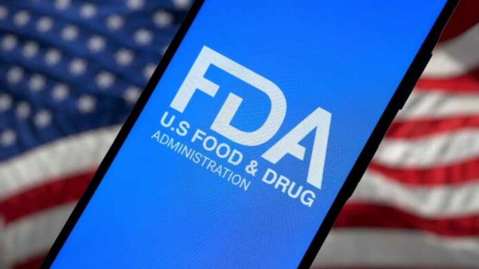 shutterstock_2593746281.jpg featured image FDA logo on smartphone American flag background