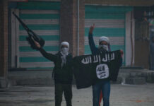 Masked Men Holding ISIS Flag