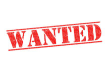 Red WANTED stamp on white background