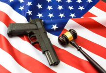 Gun and gavel on a US flag