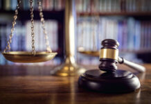 Scales and gavel on a judge's desk.