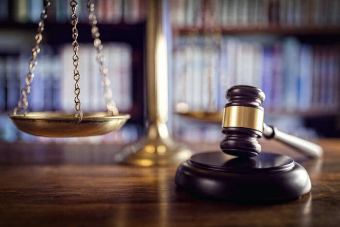 Scales and gavel on a judge's desk.