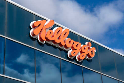 Kellogg's logo displayed on a corporate building against a blue sky