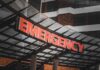 Illuminated emergency sign at a hospital entrance