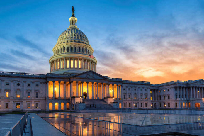 US Capitol building at sunset with reflection