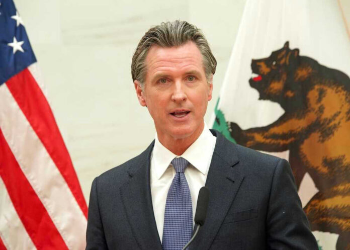 shutterstock_2150423057.jpg Gavin Newsom speaking at podium
