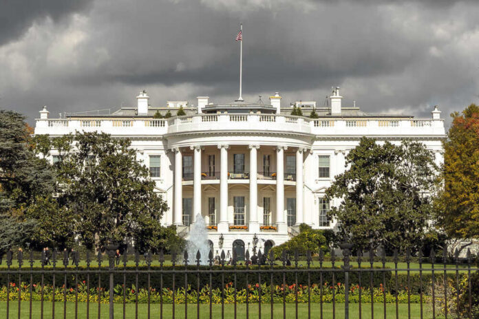 The White House with dark clouds overhead