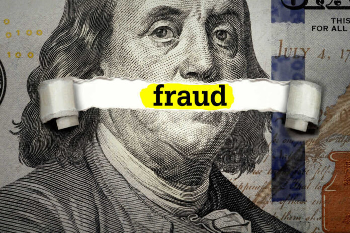 Dollar bill with fraud text overlay