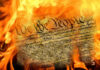 Burning U.S. Constitution amidst flames.