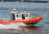 U.S. Coast Guard boat speeding through water