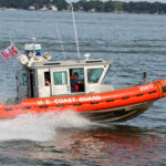 U.S. Coast Guard boat speeding through water