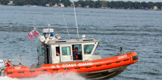 U.S. Coast Guard boat speeding through water