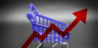 A miniature shopping cart with a rising arrow in the background
