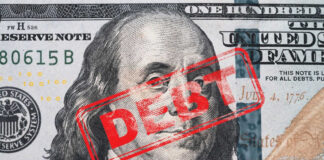 Hundred dollar bill with red debt stamp