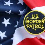 U.S. Border Patrol badge on a background of the American flag