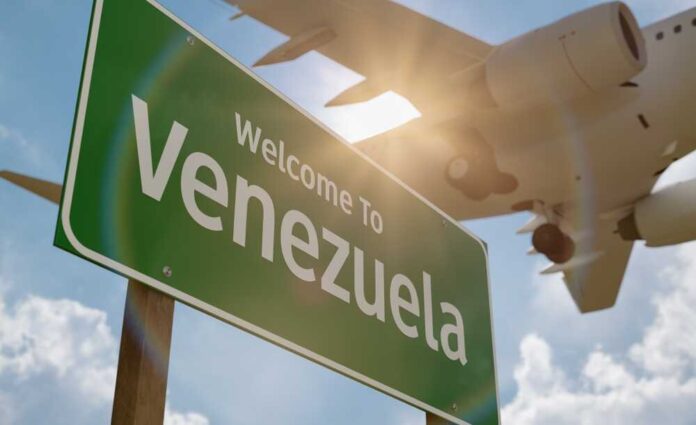 Welcome sign to Venezuela with an airplane flying overhead