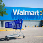 Shopping cart in a Walmart parking lot.