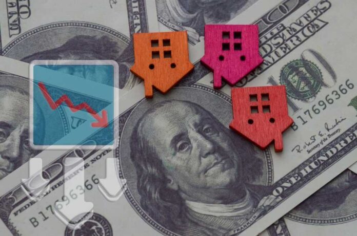 Colorful house icons on a background of hundred dollar bills with a downward trend graph