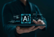 Person holding tablet with AI hologram display