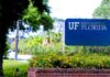 Sign for the University of Florida surrounded by greenery and flowers