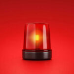 Red emergency light on red background