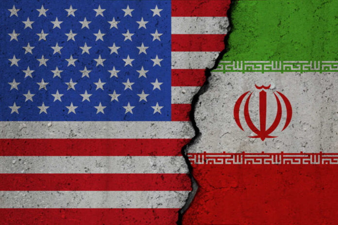 shutterstock_2376265565.jpg United States and Iran flags divided by crack