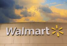 Walmart sign against a cloudy sky
