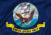 United States Navy flag with eagle and ship.